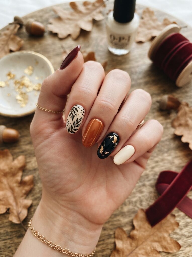![Minimalist Halloween nails with a matte black base and glossy black spiderwebs, bats, crescent moons, and French tips, sophisticated gothic manicure, vertical Pinterest photography.]