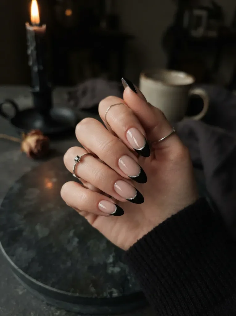 ![Halloween nail art featuring delicate white spiderwebs on glossy black and burgundy nails, tiny black spider accent, elegant gothic manicure, vertical Pinterest beauty photography.]